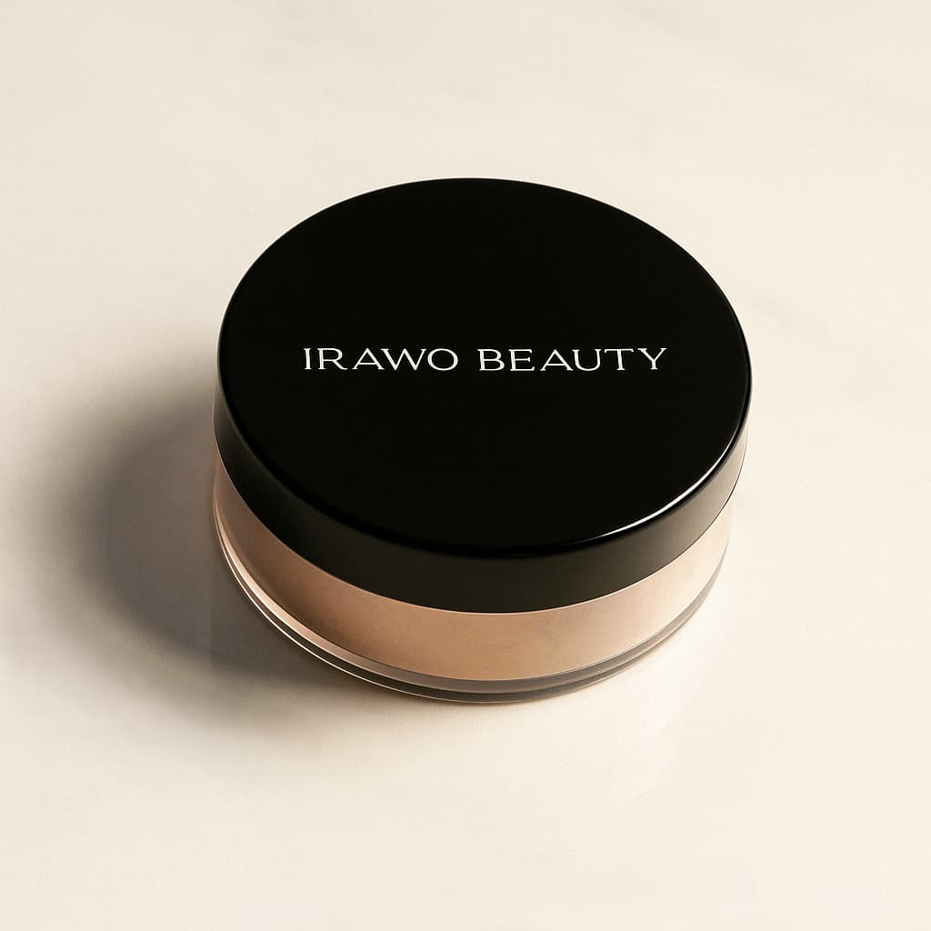 Lightweight Translucent Loose Powder from Irawo Beauty in a stylish black and clear container on a marble surface.